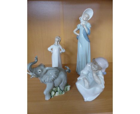 Lladro figure of a girl sitting in original Box along with another. a Nao figure and a figure of an elepant