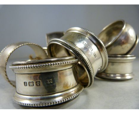 Three silver napkin rings by Charles Wilkes, two by William Hair Haseler and three further stamped 5.92.5. Total weight appro