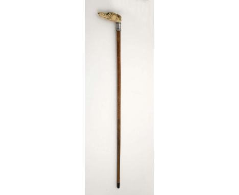 A walking stick "Greyhound head", Malacca can, silver ring engraved with PJ monogram and "Flowers", carved ivory handle, Euro
