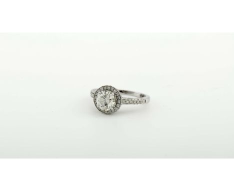 A solitaire ring, 750/000 gold, set with 58 brilliant-cut diamonds with a total weight of 0.38 ct. and in the centre with 1 b