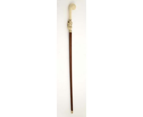 A walking stick, exotic wood with ivory tip, carved ivory handle "Eagle with cartouche", inscription "E PLURIBUS UNUM", Ameri