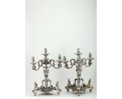 A Pair of Four-light Candelabra, Napoleon III, silver bronze en relief "Sphinxes", "Ram Heads" and "Imperial Effigies", 19th 