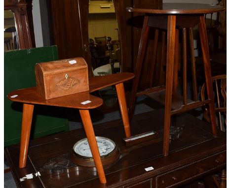 An Edwardian mahogany occasional table, a 1950's table, a 19th century tea caddy and a wheel barometer (4)