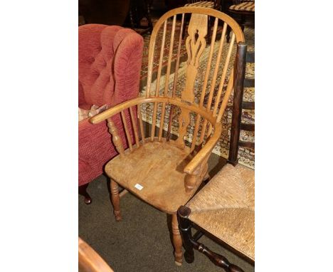 An elm seated stick back Windsor chair, pierced splat 