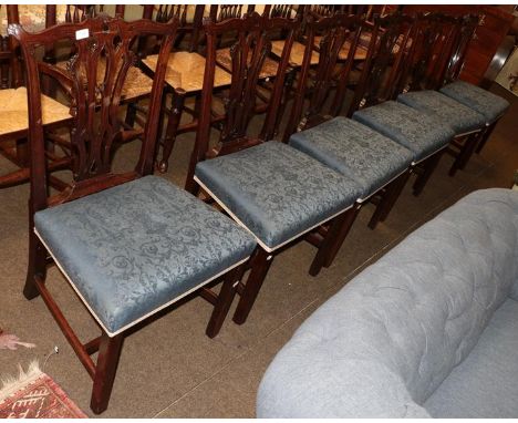 A set of six Chippendale style mahogany dining chairs, shaped top rails pierced splats, overstuffed seats (6)