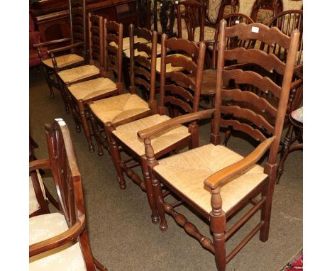 A set of six rush seated ladder back chairs including two carvers (6)