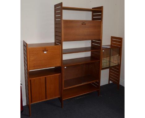 Teak Staples Ladderax sectional modular adjustable shelving units, consisting of shelves and cupboards (two with glazed front