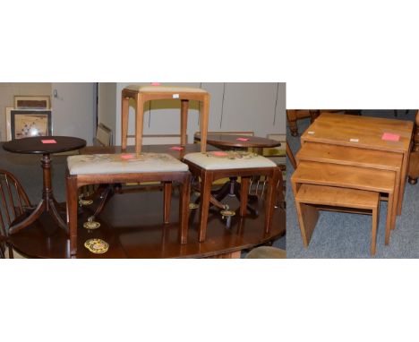 A set of six Ercol stick back dining chairs, including two carvers, labelled, together with an Ercol nest of four tables, lab