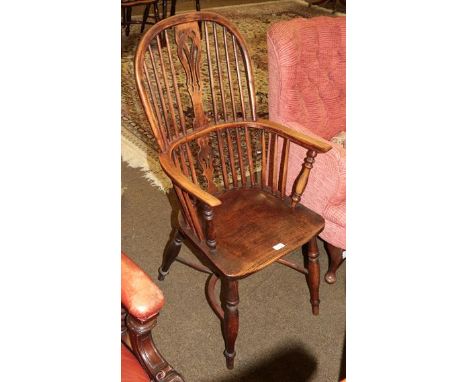 A 19th century elm seated stick back Windsor chair, pierced splat with crinoline stretcher 