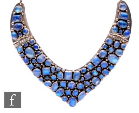 A white metal necklet set with multi cut collar set cabochon moonstones to a fox link and jump ring chain, length 42cm, termi