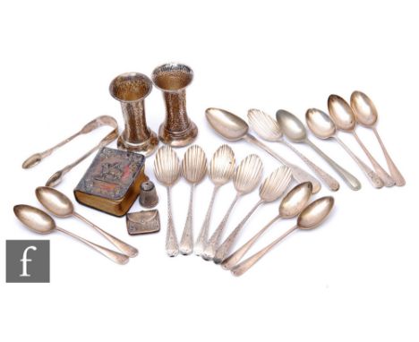 A small parcel lot of hallmarked silver items to include flatware, a stamp envelope, a thimble, sugar tongs etc, total weight