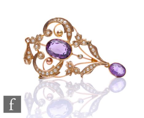 An Edwardian 9ct amethyst and seed pearl pendant/brooch with collar set amethyst central stone and drop, weight 6.5g, length 