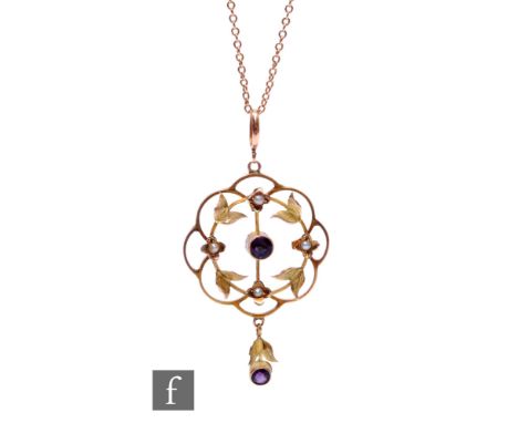 An Edwardian 9ct amethyst and seed pearl open work pendant of circular form, length 4.5cm, suspended from a 9ct trace chain w