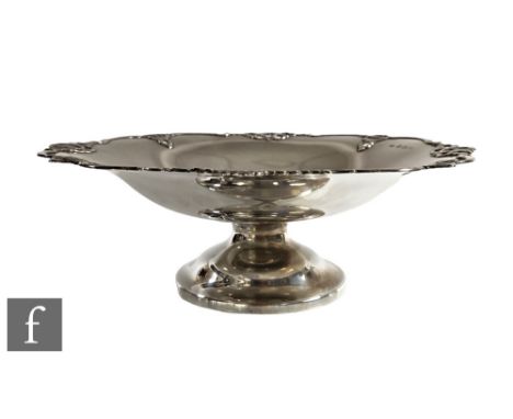 A hallmarked silver comport, circular foot below plain bowl with pierced scroll detail to borders, weight 17oz, height 10cm, 