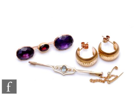 A yellow metal amethyst three stone brooch with a 9ct aquamarine and seed pearl bar brooch and a pair of 9ct earrings, total 