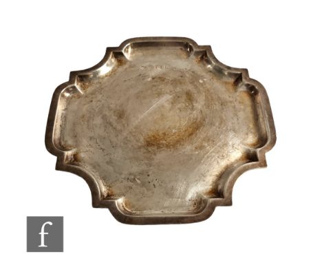 A hallmarked silver salver of plain quatrefoil shape, weight 17oz, width 28cm, Birmingham 1904, Williams Ltd, slight damage. 