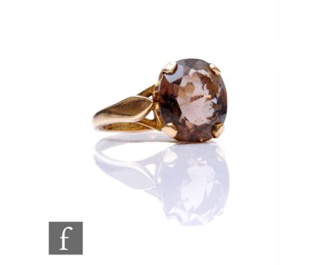 A 9ct hallmarked smoky quartz single stone ring, claw set oval stone, weight 3.3g, ring size O. 