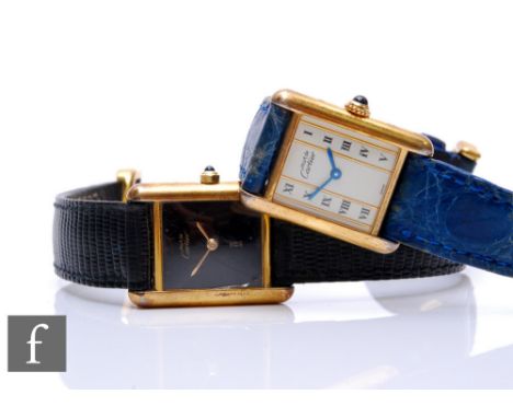 Two lady's Cartier De Must silver gilt Vermeil wrist watches, ref No 5057001 and 366001, each to a leather strap. (2) 