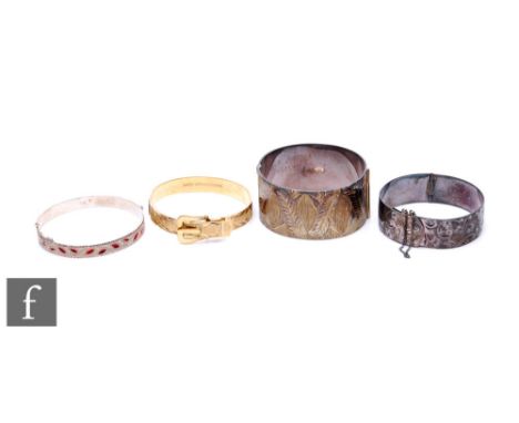 Four assorted hallmarked silver hinged bangles to include two gilt examples, total weight 145g, various styles and dates. (4)