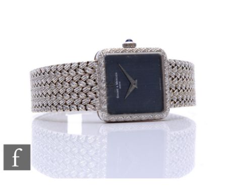 An 18ct white gold lady's Baume &amp; Mercier manual wind wrist watch, silvered hand to a square black dial, width 20mm, to a