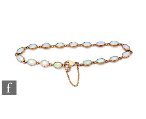 A 9ct opal bracelet comprising seventeen oval collar set opals, total weight 5.4g, terminating in lobster clasp. 