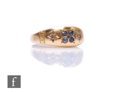 An 18ct hallmarked sapphire and diamond six stone ring, four sapphires and two diamonds, gypsy set to a boat shaped head, wei