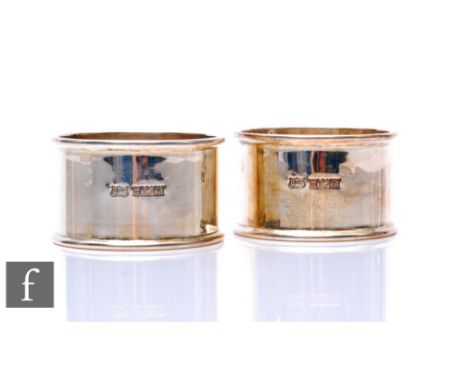 Two hallmarked silver circular napkin rings of plain form, total weight 2.35oz, Birmingham 1970. Brian Powell. (2)
