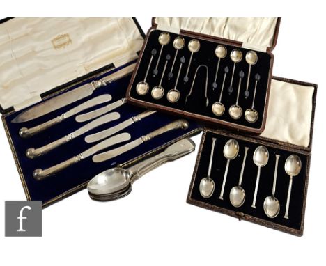 Three cased sets of assorted flatware to include tea spoons and a case of silver handled pistol grip butter knives, with a se