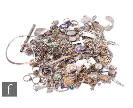 A parcel lot of silver and white metal jewellery to include chains, charm bracelets, locket, rings, fobs etc, total weight 1.