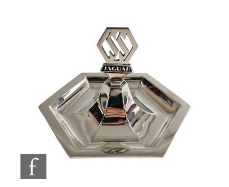 A hallmarked silver hexagonal pin dish with Jaguar picked out in black enamel below the car SS logo, weight 5oz, diameter 13c