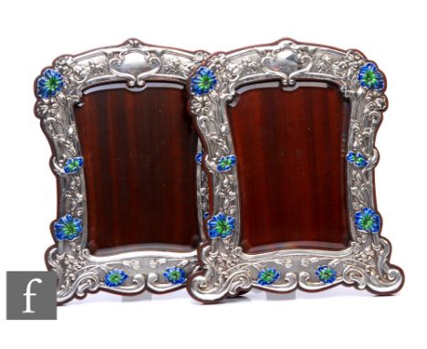 A pair of Edwardian Art Nouveau hallmarked silver rectangular easel photograph frames each with later enamelled poppy flowers