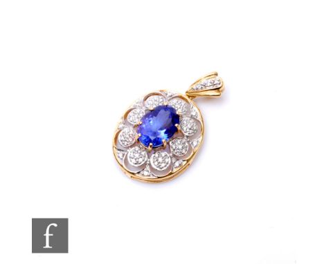 A 18ct hallmarked oval tanzanite and diamond pendant, central claw set tanzanite to a pave set diamond surround, weight 4.8g,