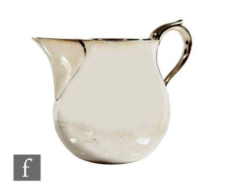 A hallmarked silver cream jug of plain form, weight 4.5oz, height 7cm, Chester 1961, Lowe &amp; Son. 