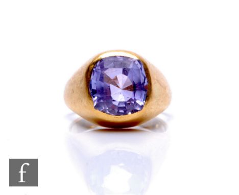 An 18ct hallmarked single stone amethyst ring, cushioned rectangular collar set stone, weight 10.5g, ring size N. 