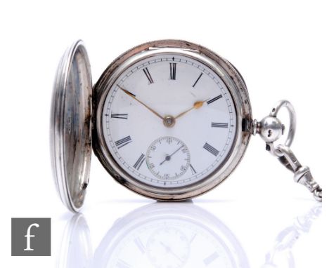 A hallmarked silver full hunter key wind pocket watch, Roman numerals to a white enamelled dial, London 1868, with a silver A