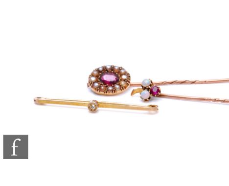 Two 9ct stone set stick pins to include a ruby and opal three stone example, with a 9ct stone set bar brooch, total weight 5.