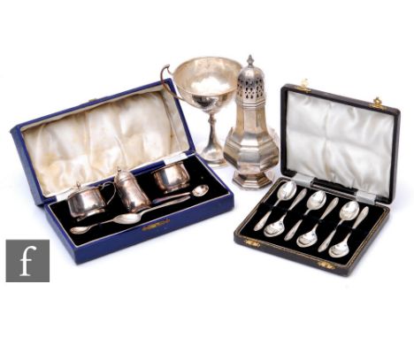 Four assorted hallmarked silver items, a sugar castor, a cased three piece cruet, a cased set of six teaspoons and a small pe
