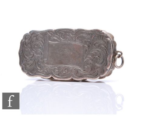 A Victorian hallmarked silver cushioned rectangular vinaigrette with part engraved foliate decoration, opening to gilt pierce