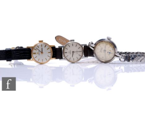 Two lady's Omega manual wind wrist watches, one 9ct gold, with a similar steel lady's Rolex. (3) 