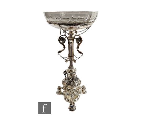 A Victorian hallmarked silver table centre piece, triform base with presentation engraving below three claw feet below centra