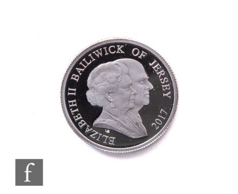 An Elizabeth II platinum proof one pound coin to commemorate the wedding anniversary of HM Queen Elizabeth &amp; HRH Duke of 