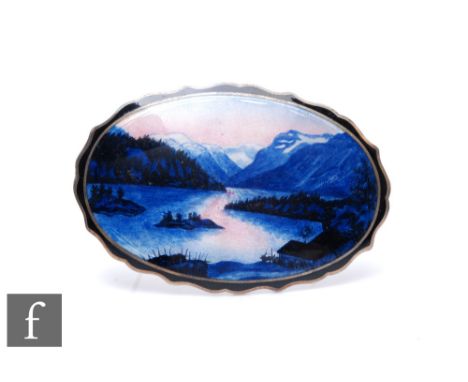A Danish silver and enamelled oval brooch depicting a mountainous lake and scene, weight 26.5g, length 6cm, Kristan Hestenes.