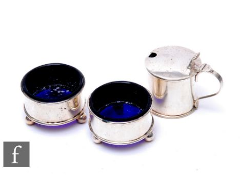 A George V silver hallmarked plain form cruet, glass liners, raised on ball supports, Chester, 1921,&nbsp;Haseler &amp; Bill 