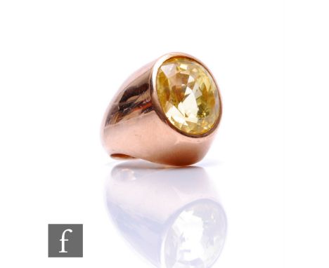 A 9ct single stone yellow beryl ring, oval facet cut collar set stone to a heavy shank, weight 22.5g, ring size M. 