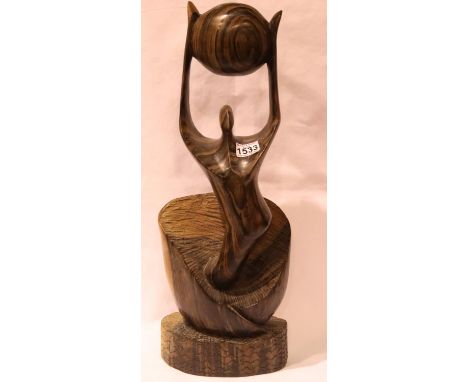 Continental hardwood carving of a figure holding a ball,  signed Ruth Lea, H: 60 cm. P&P Group 3 (£25+VAT for the first lot a