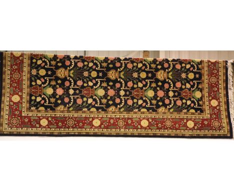Large wool blue ground patterned floor rug, fringed, 322 x 265 cm. Not available for in-house P&P, contact Paul O'Hea at Mail