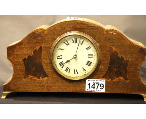Edwardian inlaid mahogany mantel clock, the movement set into a shaped form surround, H: 16 cm, not working at time of lottin