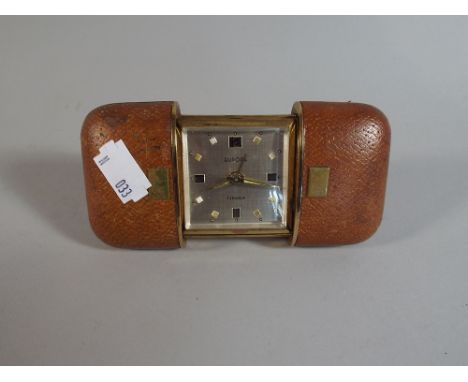 A Europa Leather Cased Travelling Alarm Clock with Retractable Stand