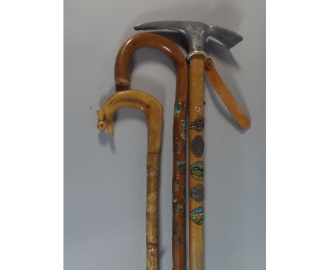 A Souvenir Italian Ice Axe, Horn Handled Walking Stick, Walking Stick with Austrian and Other Souvenir Badges  