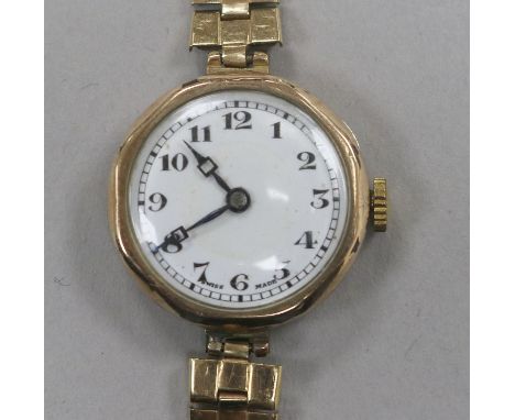 A lady's 9ct gold Rolex manual wind wrist watch, with engraved monogram, on later associated 9ct gold bracelet.